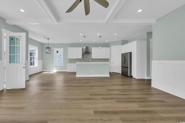 868 Crystal Water Way, Myrtle Beach, SC 29579 - unfurnished living room featuring wood finished floors, a ceiling fan, beam ceiling, and recessed lighting