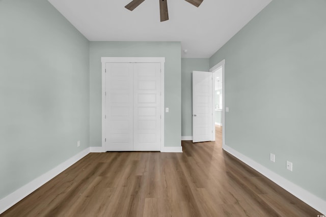 868 Crystal Water Way, Myrtle Beach, SC 29579 - unfurnished bedroom featuring wood finished floors, a closet, and a ceiling fan