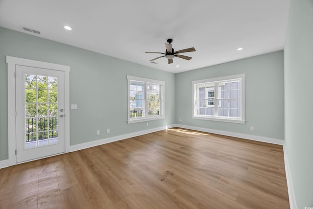 868 Crystal Water Way, Myrtle Beach, SC 29579 - unfurnished room featuring plenty of natural light, a ceiling fan, wood finished floors, and recessed lighting