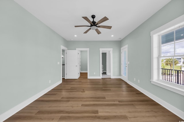 868 Crystal Water Way, Myrtle Beach, SC 29579 - unfurnished bedroom featuring wood finished floors, recessed lighting, and a ceiling fan