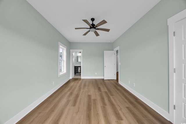 868 Crystal Water Way, Myrtle Beach, SC 29579 - unfurnished bedroom with wood finished floors, ensuite bathroom, and a ceiling fan