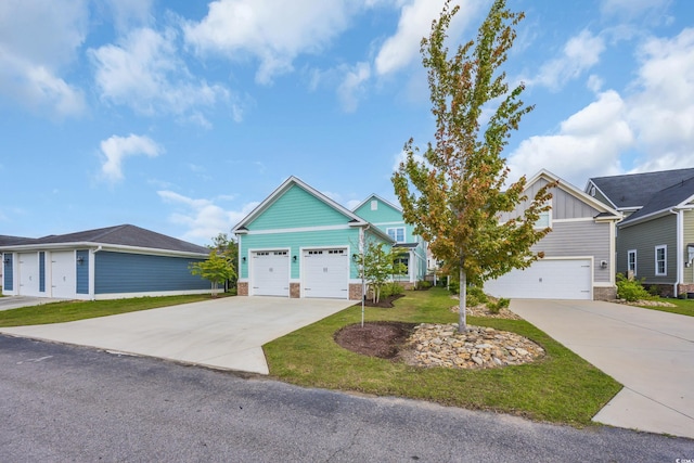 868 Crystal Water Way, Myrtle Beach, SC 29579 - view of front facade with driveway, a garage, board and batten siding, a front yard, and stone siding
