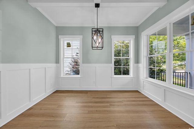 868 Crystal Water Way, Myrtle Beach, SC 29579 - unfurnished dining area with light wood-type flooring, a wainscoted wall, a decorative wall, and ornamental molding