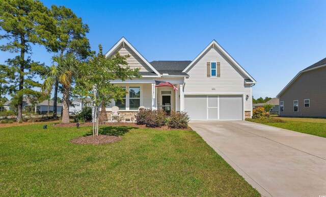 ranch-style home featuring driveway, a front lawn, and covered porch