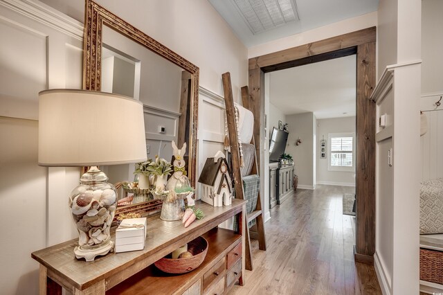 corridor featuring wood finished floors