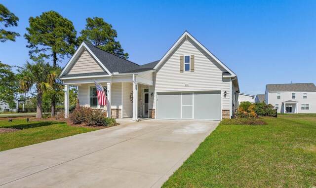 view of front of property with a garage, concrete driveway, a front lawn, and covered porch