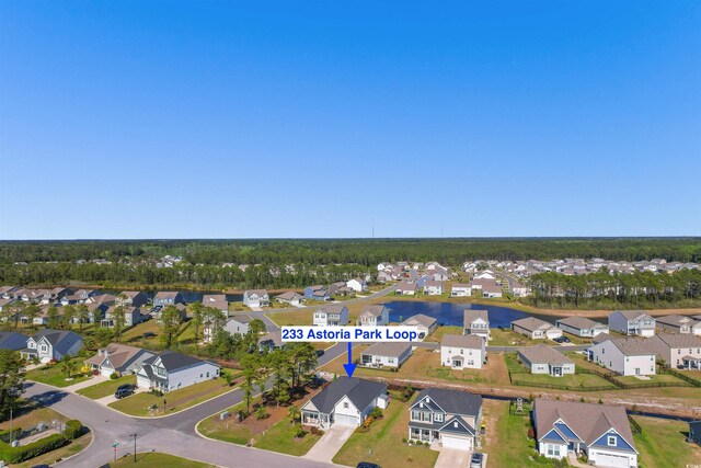 view of property's community featuring a lawn and a patio area