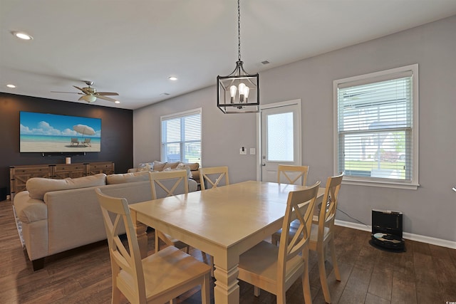 dining space featuring recessed lighting, baseboards, dark wood-style floors, and ceiling fan with notable chandelier