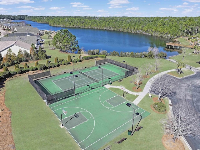 view of sport court with fence, community basketball court, a water view, and a forest view