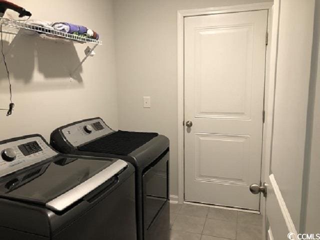 1835 Berkley Village Loop, Myrtle Beach, SC 29579 - washroom with washing machine and dryer and light tile patterned floors