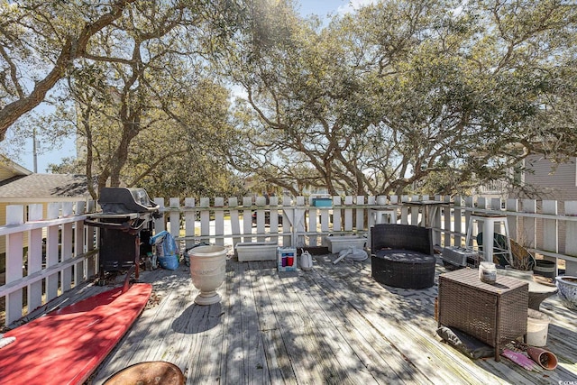 wooden terrace with area for grilling