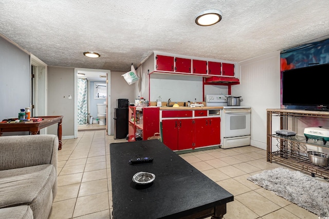 kitchen featuring red cabinets, electric stove, a sink, and light tile patterned floors