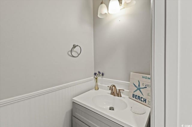 bathroom featuring vanity and a wainscoted wall