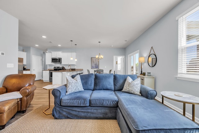 2771 Eclipse Dr, Myrtle Beach, SC 29577 - living area with a chandelier, light wood finished floors, and recessed lighting