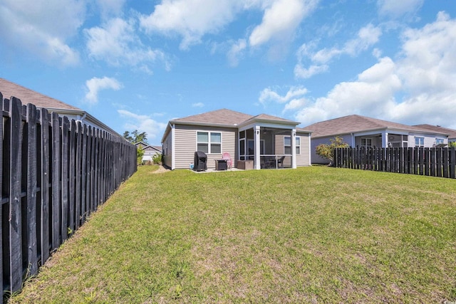 2771 Eclipse Dr, Myrtle Beach, SC 29577 - back of house featuring a sunroom and a fenced backyard