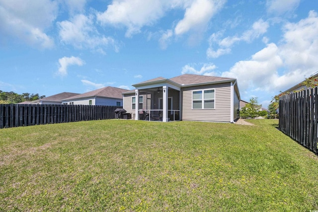 2771 Eclipse Dr, Myrtle Beach, SC 29577 - rear view of house featuring a sunroom and a fenced backyard