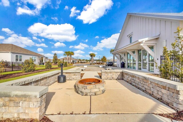 2771 Eclipse Dr, Myrtle Beach, SC 29577 - view of patio with an outdoor fire pit and a residential view