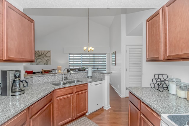 4913 Twin Pond Ct Unit 202, Myrtle Beach, SC 29579 - kitchen with white dishwasher, a sink, a chandelier, light wood-style flooring, and pendant lighting