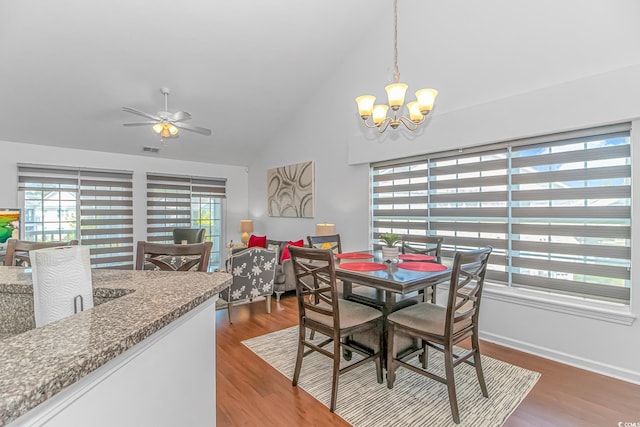 4913 Twin Pond Ct Unit 202, Myrtle Beach, SC 29579 - dining space with ceiling fan with notable chandelier, wood finished floors, and vaulted ceiling