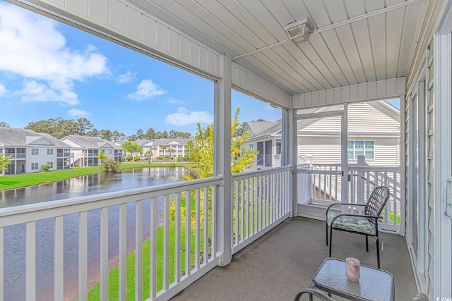 4913 Twin Pond Ct Unit 202, Myrtle Beach, SC 29579 - sunroom featuring a residential view and a water view