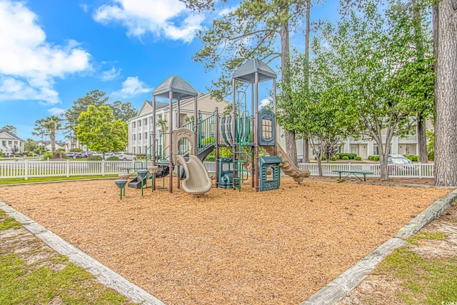 community jungle gym featuring fence