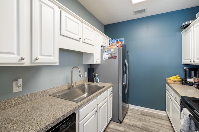 kitchen with light wood finished floors, a sink, visible vents, white cabinetry, and stainless steel fridge with ice dispenser