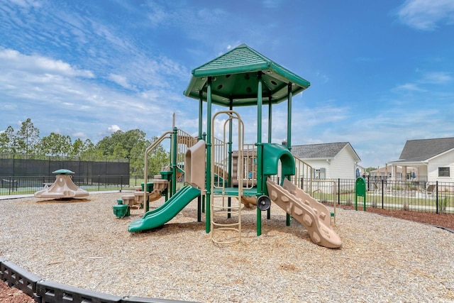 community jungle gym featuring fence