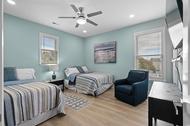 1010B S Ocean Blvd, Surfside Beach, SC 29575 - bedroom with light wood finished floors, recessed lighting, and a ceiling fan