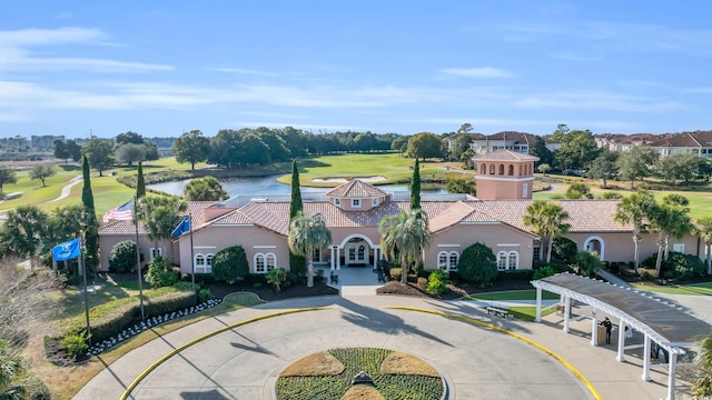 aerial view featuring golf course view and a water view
