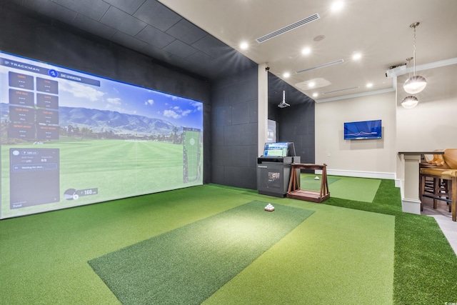 recreation room with concrete block wall, golf simulator, visible vents, crown molding, and carpet floors