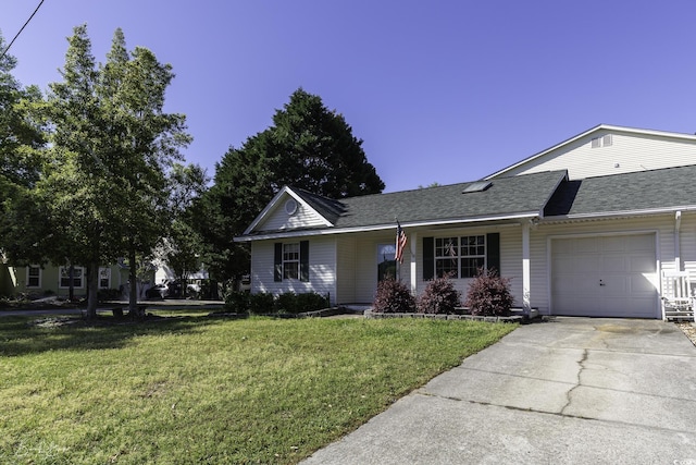 409 5th Ave S Unit 409, Surfside Beach, SC 29575 - view of front of house with a garage, a front lawn, driveway, and roof with shingles