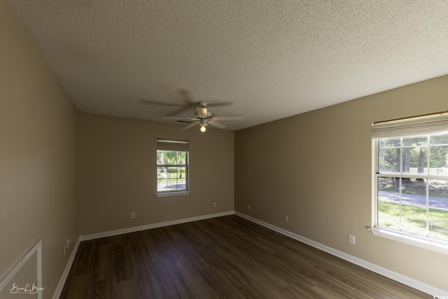 409 5th Ave S Unit 409, Surfside Beach, SC 29575 - unfurnished room featuring dark wood-style floors, a ceiling fan, a textured ceiling, and baseboards