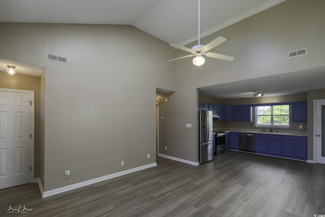409 5th Ave S Unit 409, Surfside Beach, SC 29575 - kitchen with blue cabinets, stainless steel appliances, high vaulted ceiling, a sink, and light countertops