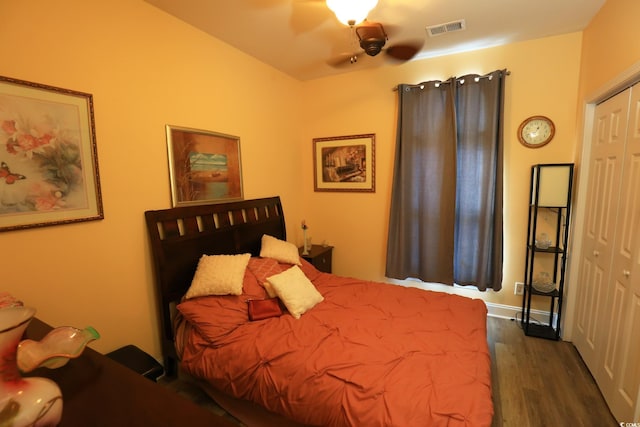 110 Portsmith Dr Unit 8, Myrtle Beach, SC 29588 - bedroom with dark wood-style flooring, a closet, and ceiling fan