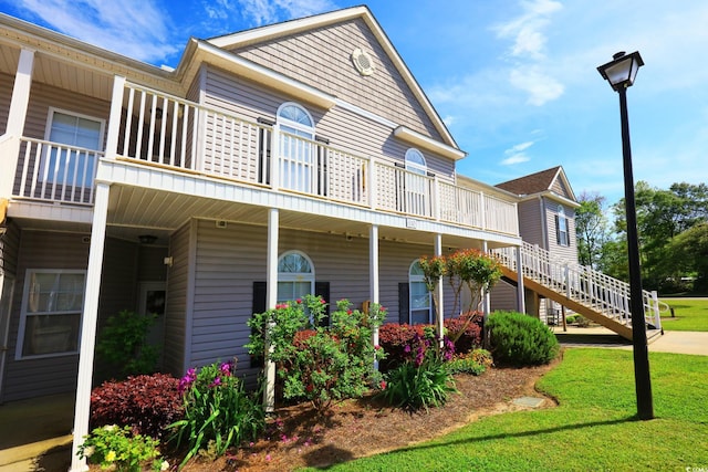 110 Portsmith Dr Unit 8, Myrtle Beach, SC 29588 - view of front of property featuring a balcony and a front lawn