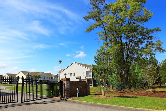 110 Portsmith Dr Unit 8, Myrtle Beach, SC 29588 - view of front of home featuring a residential view, brick siding, and a gate