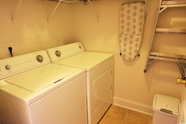 110 Portsmith Dr Unit 8, Myrtle Beach, SC 29588 - laundry room with washer and dryer, baseboards, and light tile patterned flooring