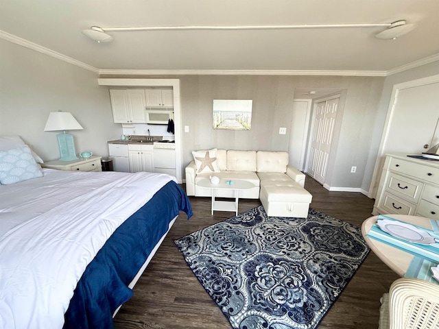2001 S Ocean Blvd S Unit 511, Myrtle Beach, SC 29577 - bedroom with crown molding, a sink, baseboards, wet bar, and dark wood-type flooring