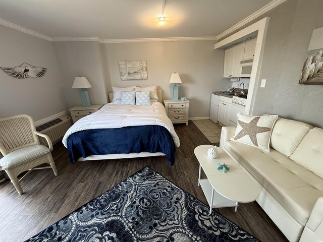 2001 S Ocean Blvd S Unit 511, Myrtle Beach, SC 29577 - bedroom with baseboards, ornamental molding, and wood finished floors