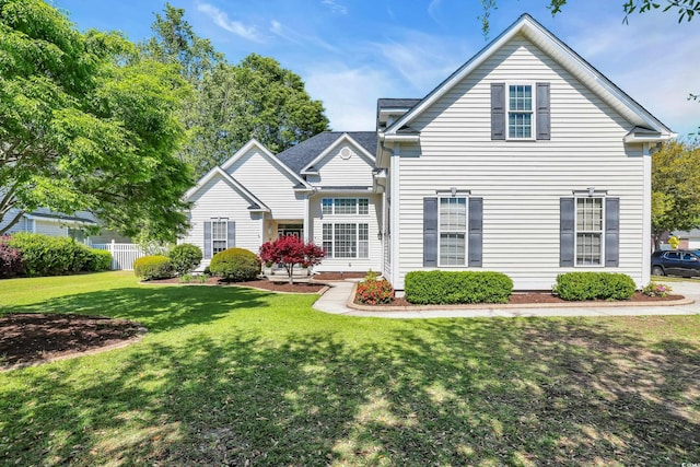traditional-style home featuring a front yard