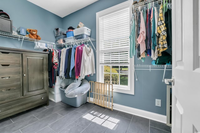 spacious closet featuring tile patterned floors