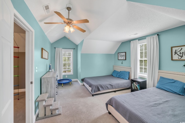 bedroom featuring carpet floors, multiple windows, vaulted ceiling, and visible vents