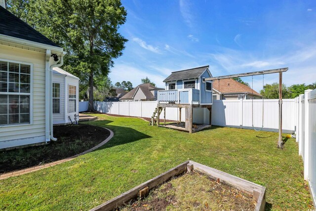 3300 Prioloe Dr, Myrtle Beach, SC 29588 - fenced backyard featuring a vegetable garden