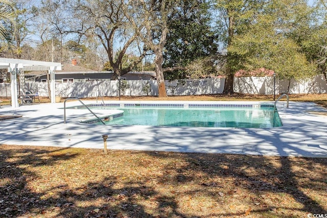 view of pool with a pergola, a fenced in pool, a fenced backyard, and a patio