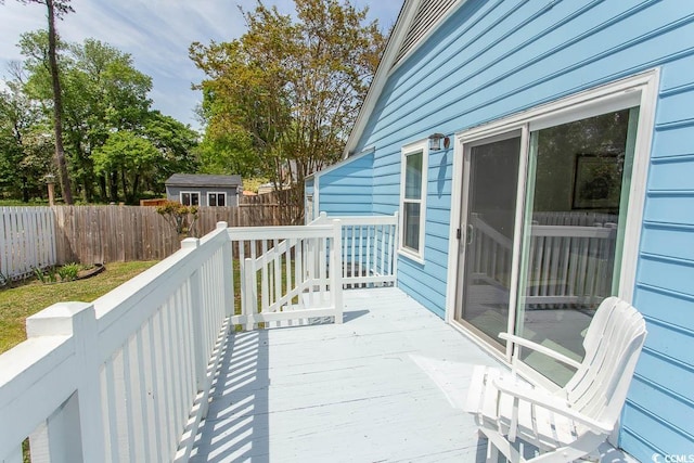 wooden deck featuring fence