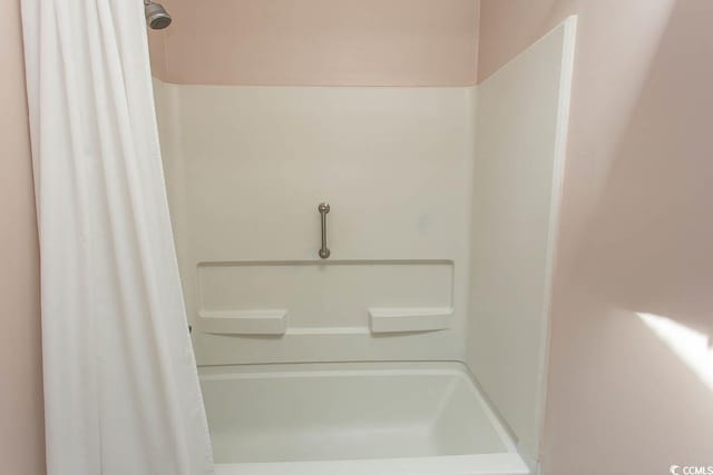 full bathroom with a shower with shower curtain