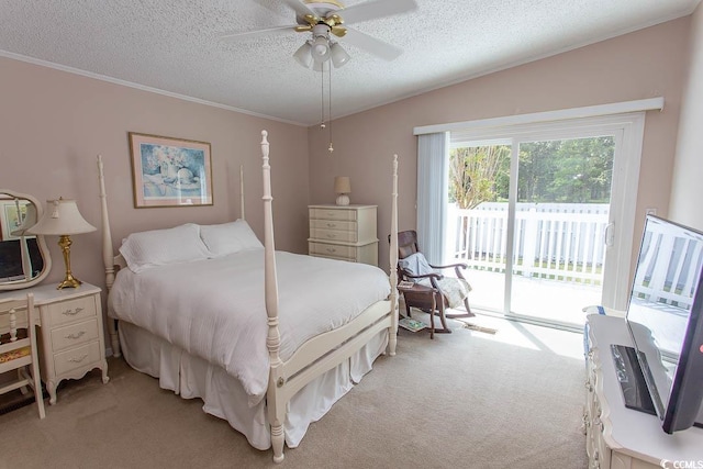 bedroom with ornamental molding, access to outside, a textured ceiling, and light colored carpet