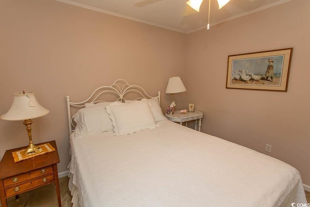 bedroom with baseboards, carpet floors, ceiling fan, and crown molding