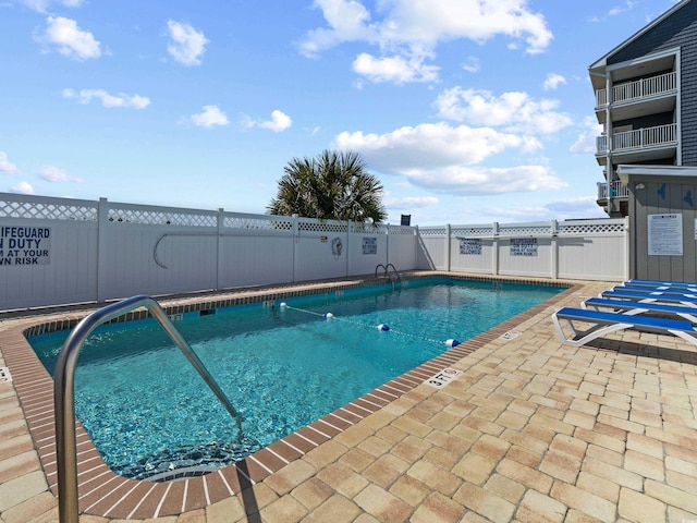 5000 N Ocean Blvd Unit B-1, North Myrtle Beach, SC 29582 - community pool with a patio and fence