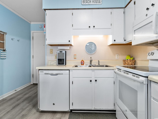 5000 N Ocean Blvd Unit B-1, North Myrtle Beach, SC 29582 - kitchen featuring white appliances, light wood-style floors, light countertops, white cabinetry, and a sink